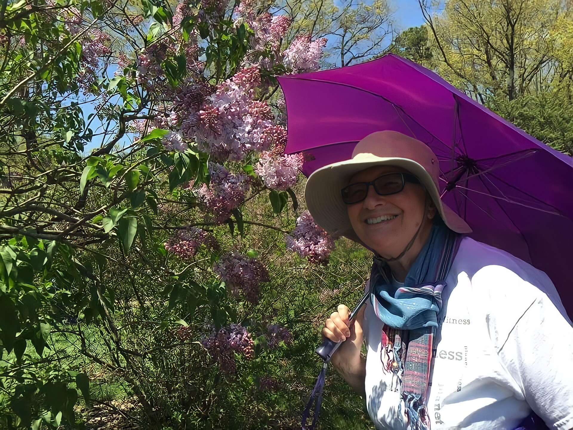 Cousin Lia at the brooklyn botanical gardens with a purple umbrella